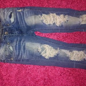 Distressed white washed boot cut jeans